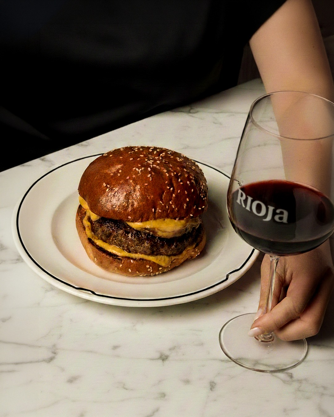 Enjoy a juicy combination. When it comes to pairing well with a medium-rare cheeseburger, a Rioja red gives French fries a run for their money.
