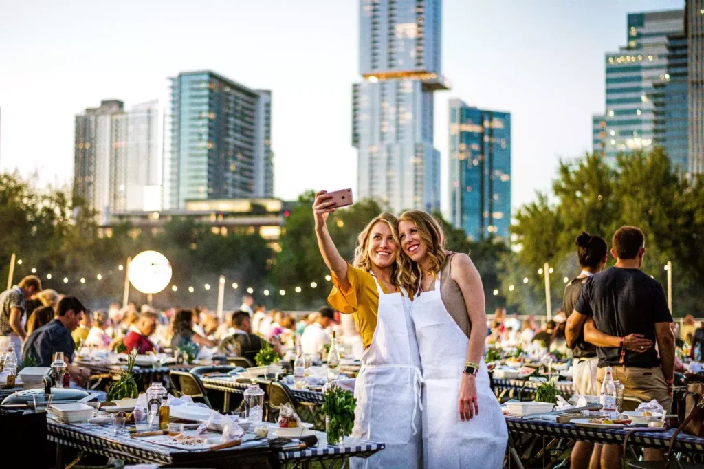 Two women pose at Austin Wine & Food Festival